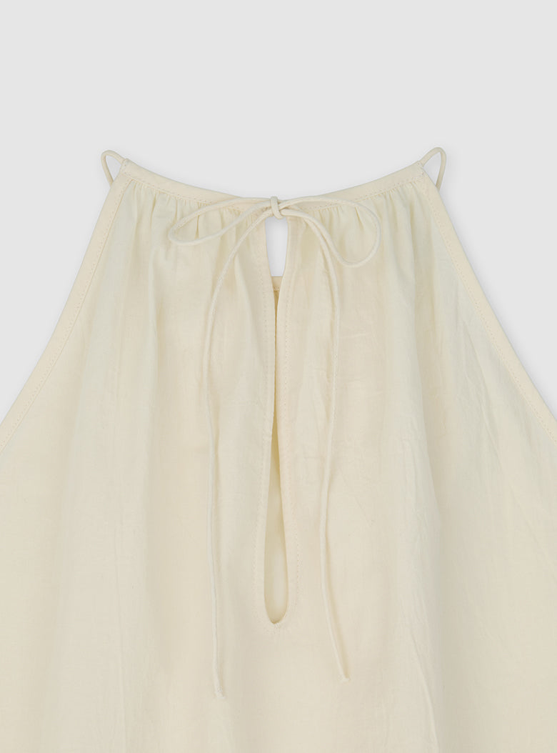Cream sleeveless summer top with linen-like texture