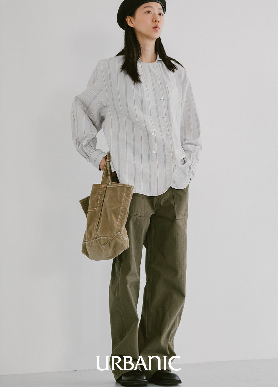 Minimal atelier-inspired shirt styled with structured bottoms
