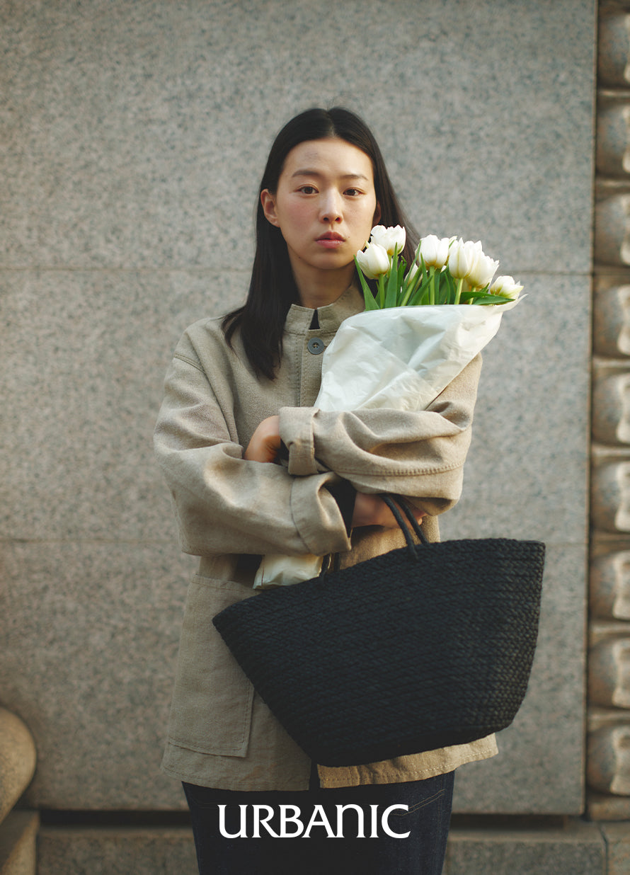 timeless look with herringbone pants and raffia tote