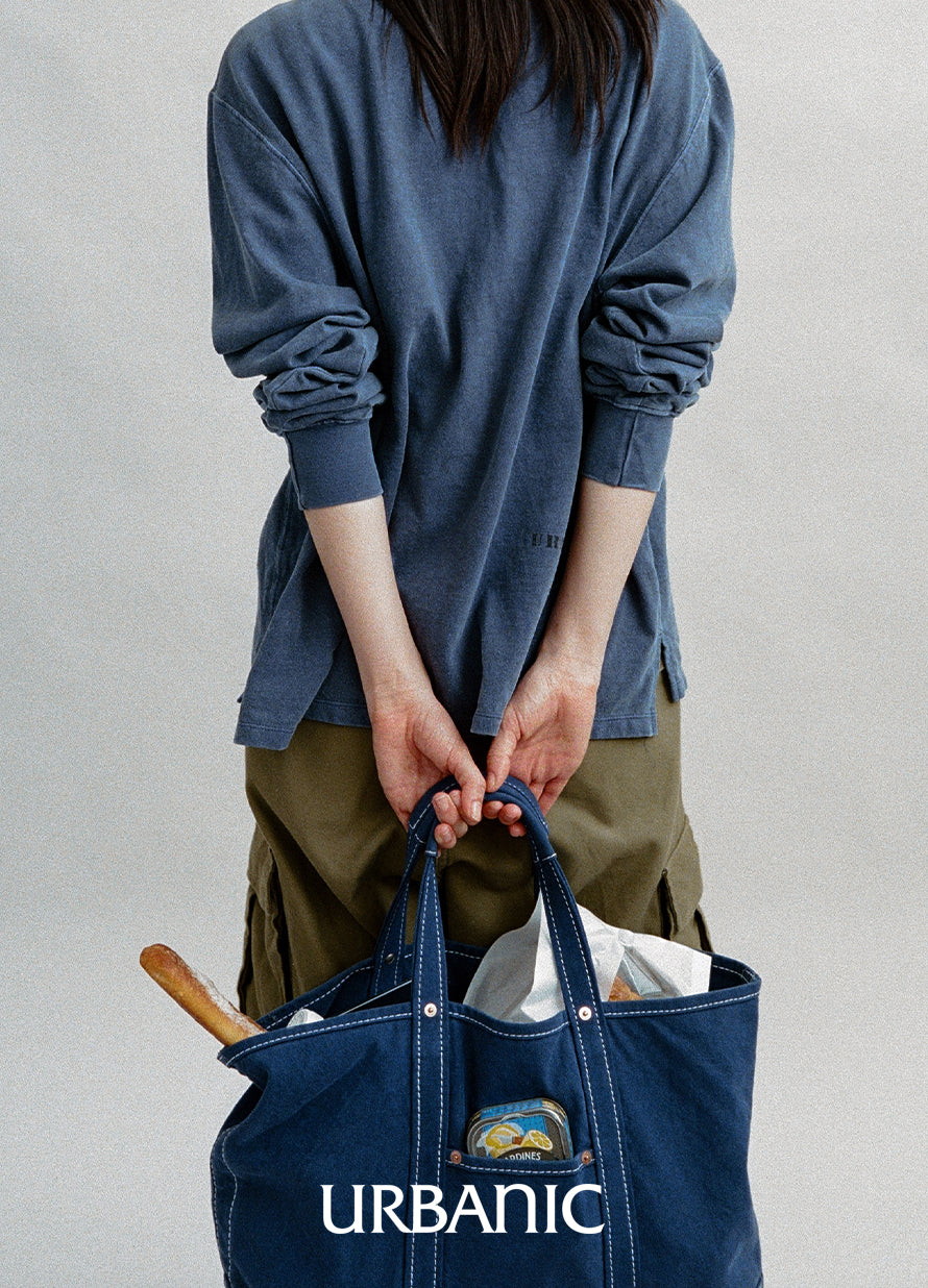 Casual long-sleeve tee with washed-out seams and a worn-in texture.