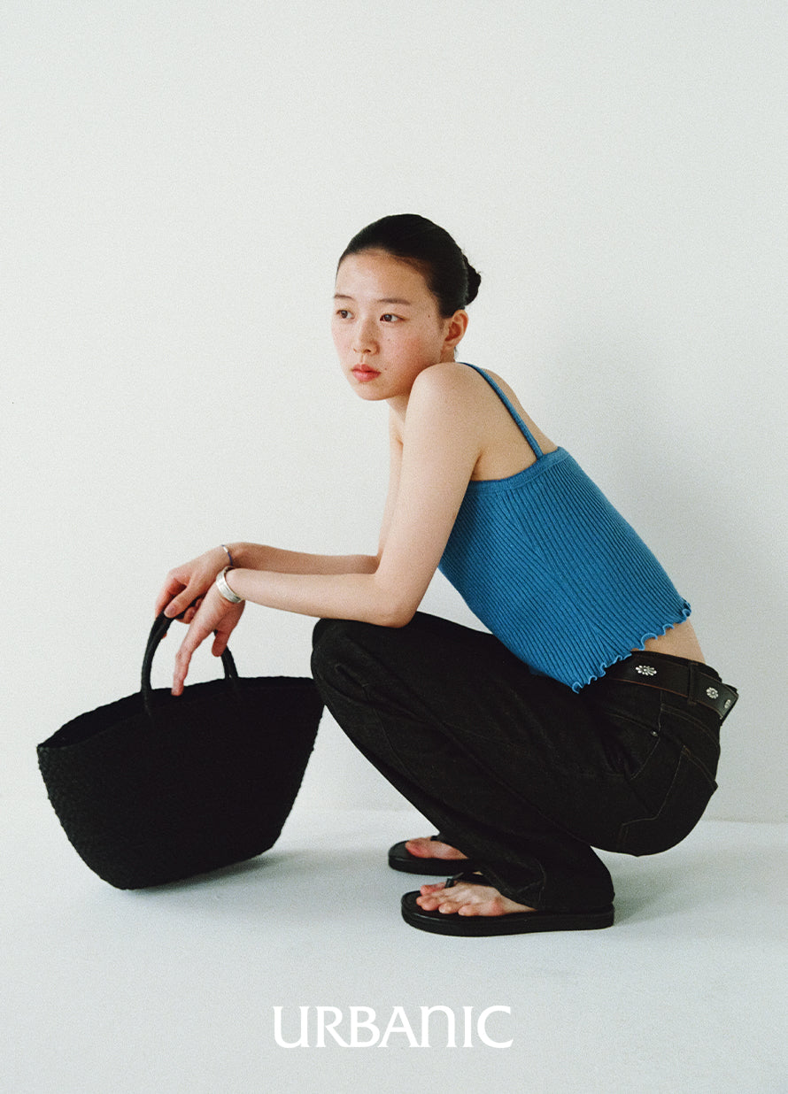 Feminine ribbed tank top with decorative loops and ruffle-like edging