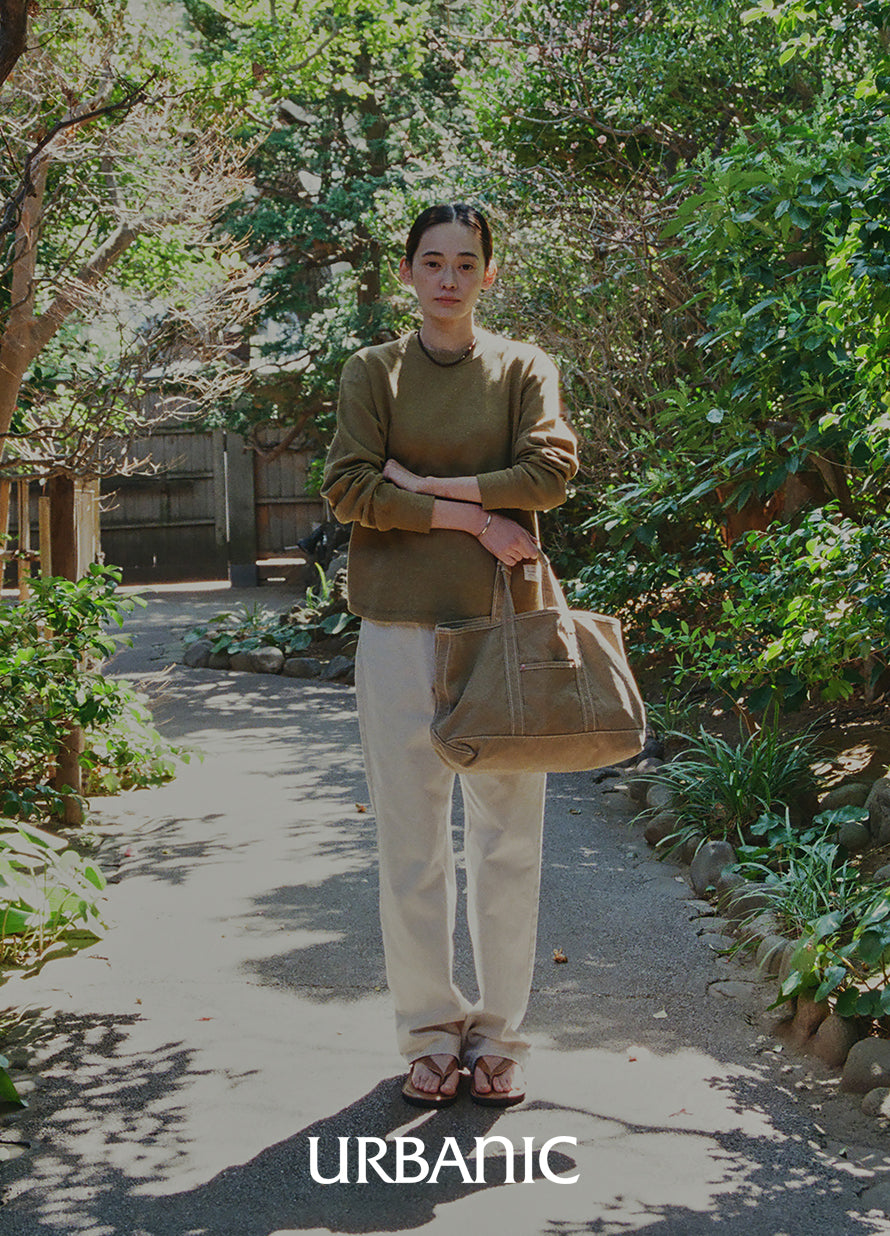 olive color sweatshit with denim pants outfit