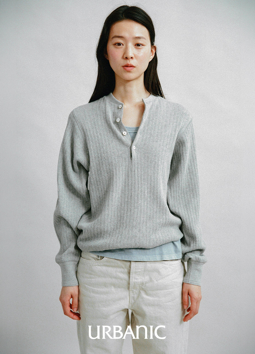 henely-neck knit with denim pants