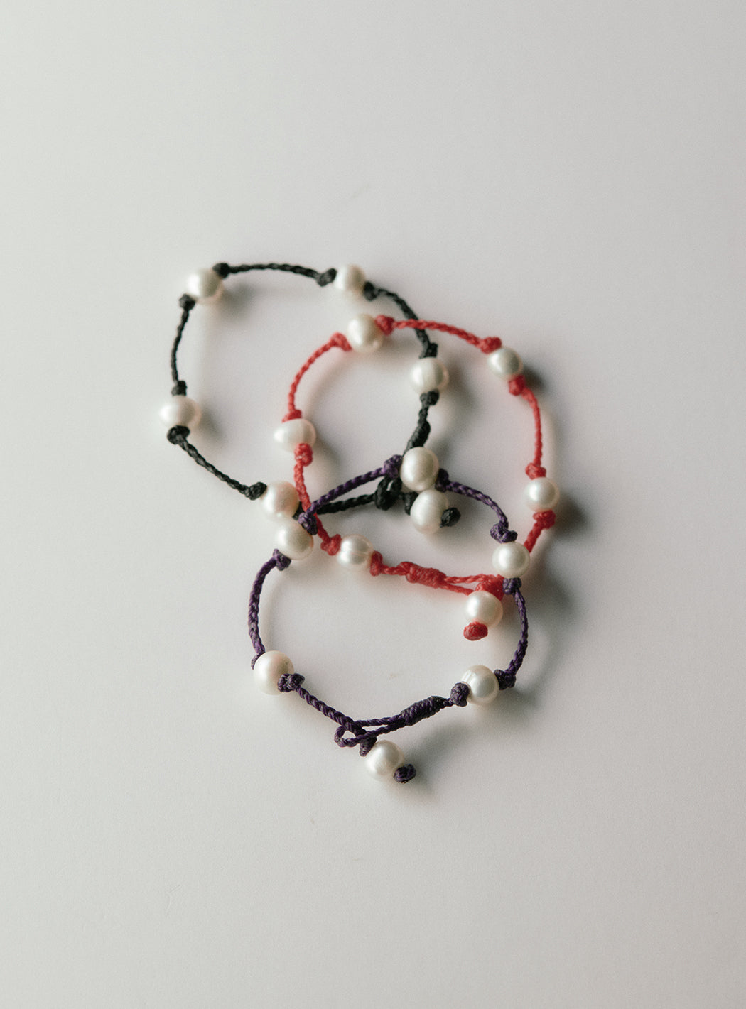 Freshwater pearl bracelet on waxed polyester cord
