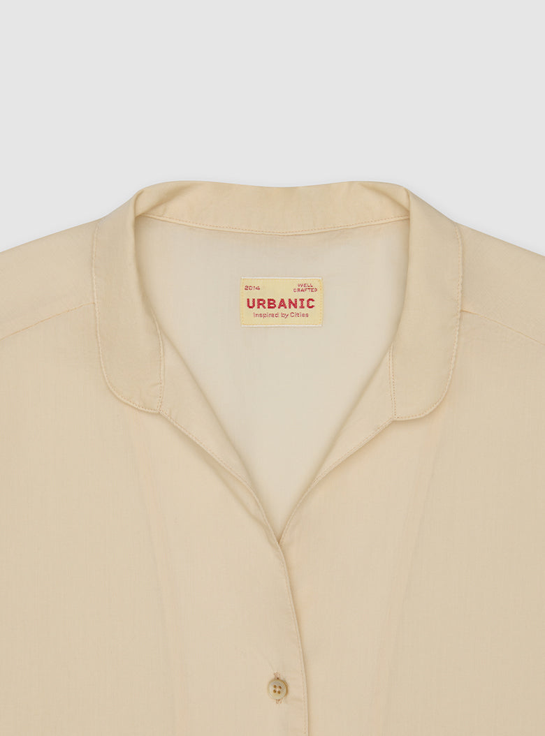 Delicate sheer cotton shirt with subtle button detailing