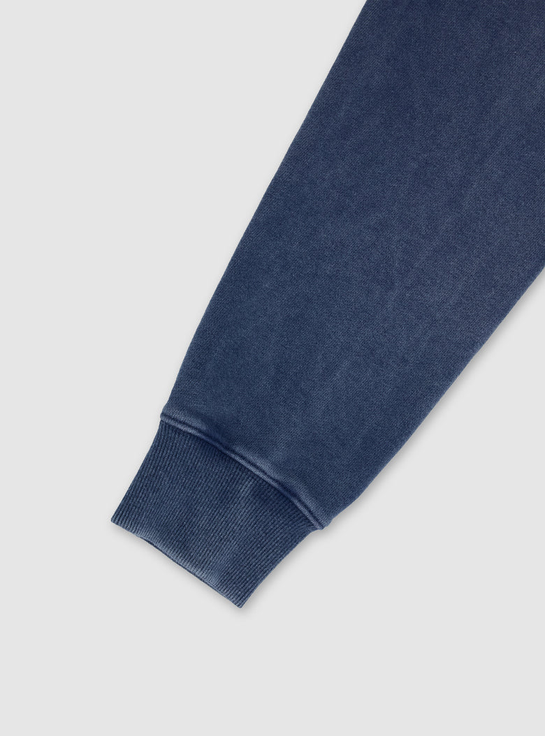 Casual cotton top with faded seams, hems, and ribbed trims.