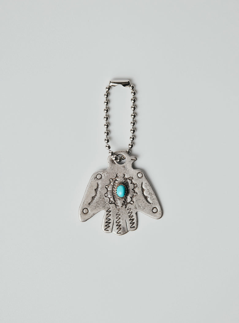 Silver-plated brass thunderbird key charm with Arizona turquoise