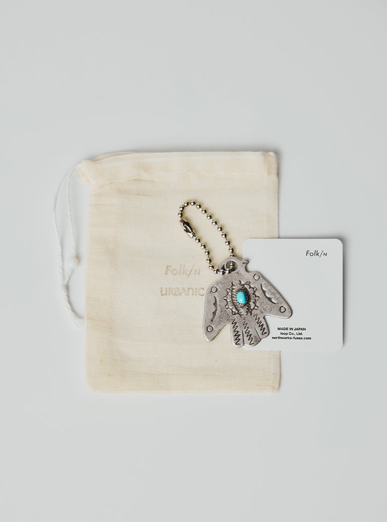 Engraved thunderbird charm with silver-tone ball chain