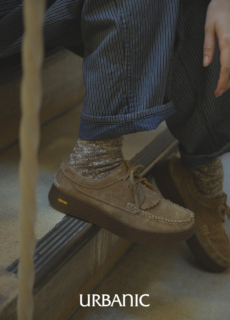 subtle stripe pants paired with camel lace-up shoes