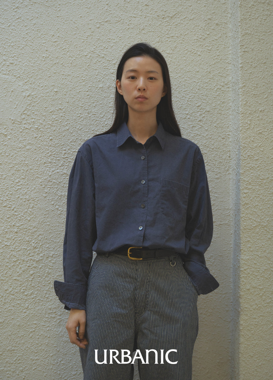 navy shirt styled with subtle stripe pants