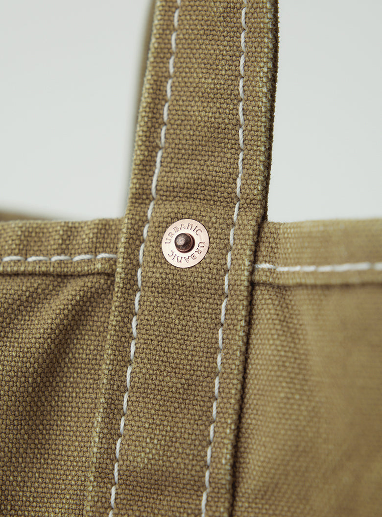 Tote bag with brass rivets and vintage print detail