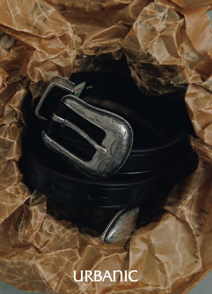 Vintage-style leather belt with engraved silver-tone brass hardware and rope-edge detailing