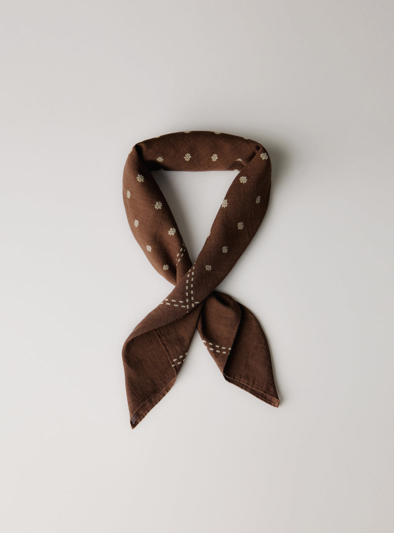 GOTS-certified organic cotton scarf in warm brown tones