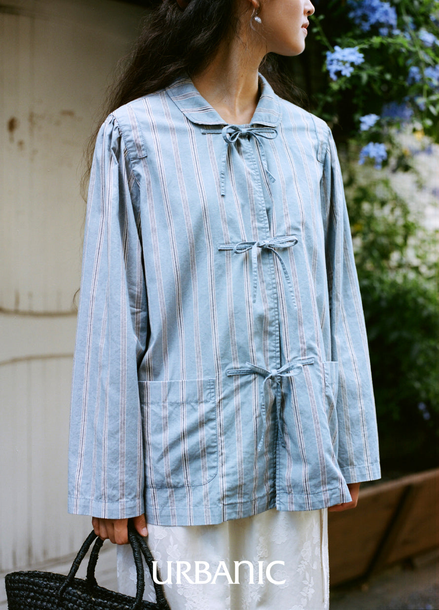 Shirt with taped shoulder details and front tie fastening