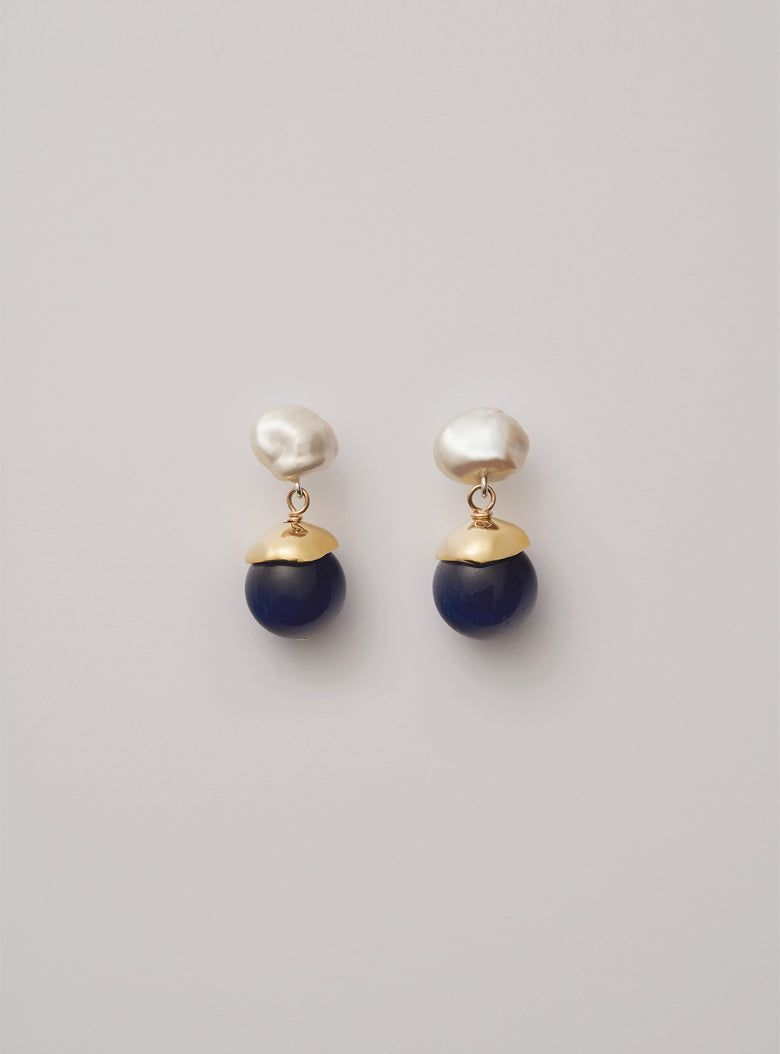 Women’s pearl drop earrings with luminous blue beads