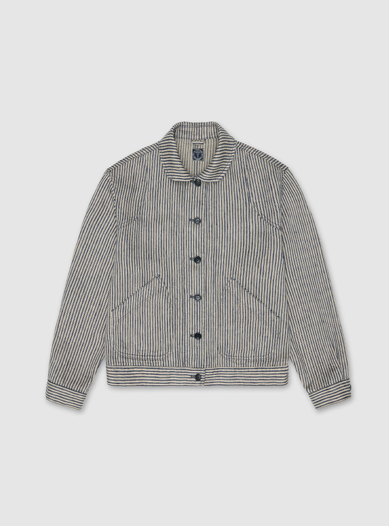A short, boxy trucker jacket in navy stripe linen, featuring a lively and modern silhouette