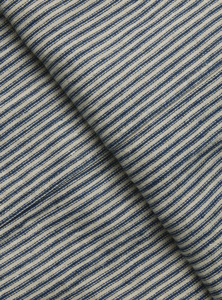 Close-up of 100% linen twill fabric with multi-width navy stripes for a naturally timeworn look